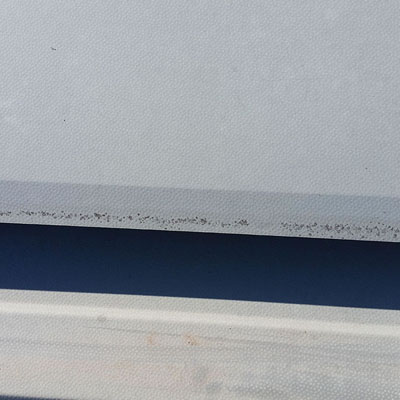 Chalking and thinning revealing loss of roof surface protection