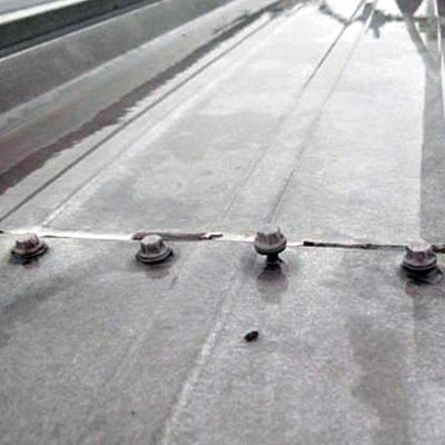 Fastener Fatigue: Why Screws Fail Years Before the Roof Does