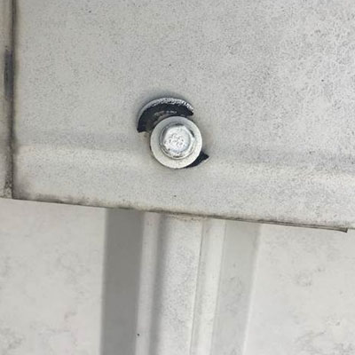 Fastener Fatigue: Why Screws Fail Years Before the Roof Does