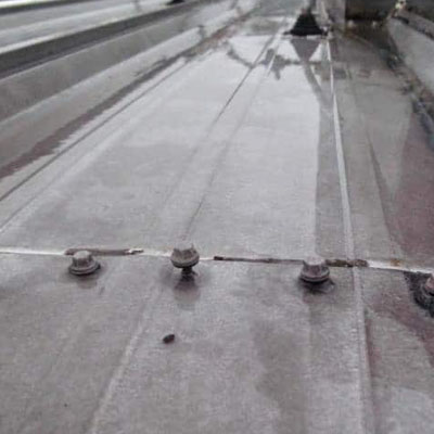 Surface level roof dent not affecting water flow