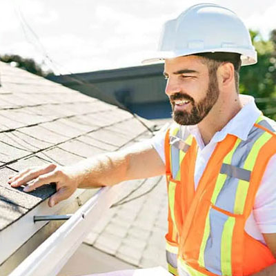 Building inspector assessing roof before contract finalisation
