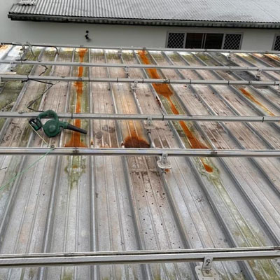 Roof corrosion developing under solar panel array